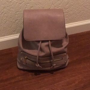 Medium sized backpack. Lavender/light purple